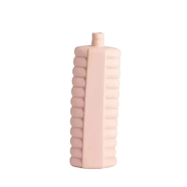 Pink textured bottle on a white background